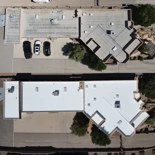 The stark contrast of a rooftop before and after Paramount&apos;s silicone roof coating application.