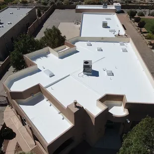 A stunning shot of a freshly applied silicone roof coating gleaming in the midday sun.