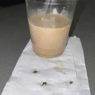 a cup of coffee on a napkin