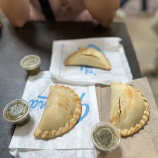 three empanadas on a table