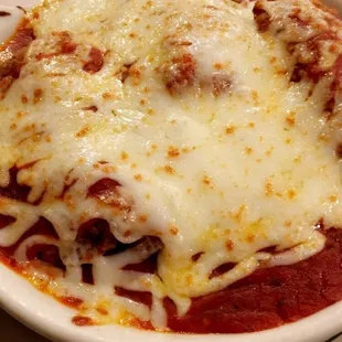 Chicken Parmesan over spaghetti