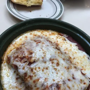 Baked lasagna with garlic bread