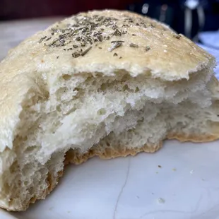 Bread for the table with oil and vinegar (I think?) and salt and pepper
