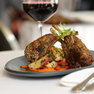 a plate of food and a glass of wine