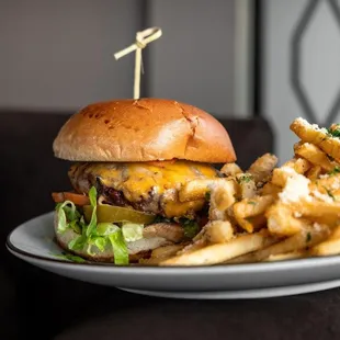 a cheeseburger and fries on a plate