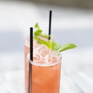 a close up of a drink in a tall glass