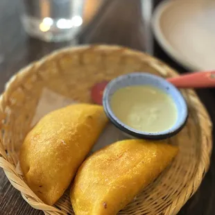 EMPANADA DE AJIACO (2) shredded chicken &amp; papa, corn &amp; capers jalapeño-cilantro aioli Made from Colombia corn ！