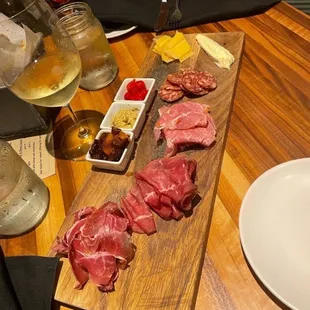 meat and cheese on a cutting board