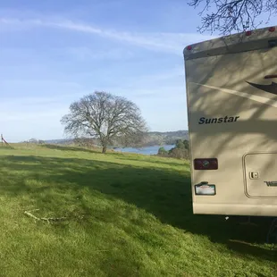 Beautiful site overlooking the lake.  Love the oak trees!  Watch those low hanging branches.