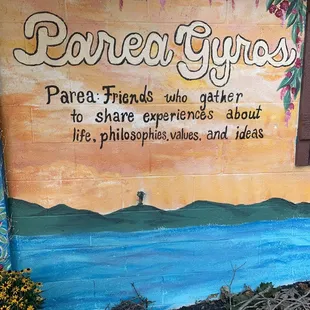 a painted sign on the side of a building