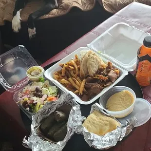 Platter (lamb, pita, hummus, fries, Greek salad) grape leaves