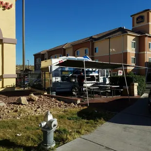 a truck parked in front of a restaurant
