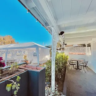 a patio with a table and chairs