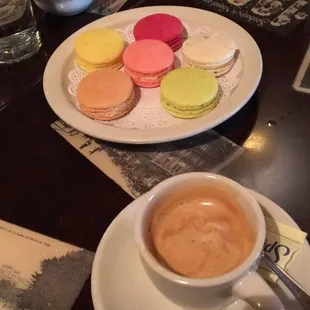 Chef variety of macarons and espresso.