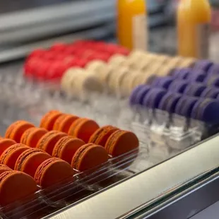 a display of macarons in a pastry shop