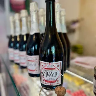 bottles of wine on a glass shelf