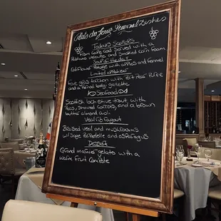 a menu on a blackboard in a restaurant