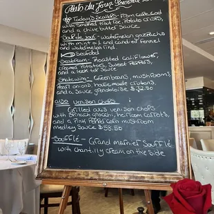 a menu on a blackboard in a restaurant