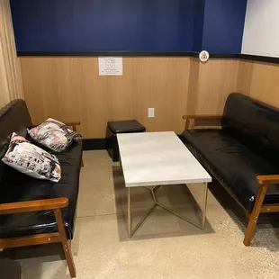 a couch and a table in a waiting room