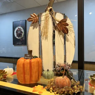 a display of pumpkins and other decorations
