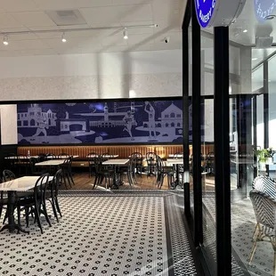 Optional private seating with cool art backdrop.