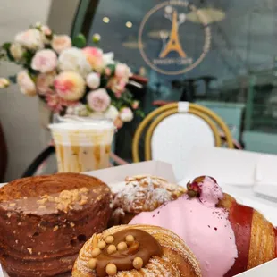 Raspberry Rose croissant, the Ferrero Rocher rolled croissant,  the almond croissant, and the caramel cruffin