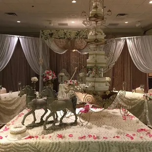 a wedding cake with a horse and carriage