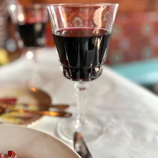 a plate of food and a glass of wine