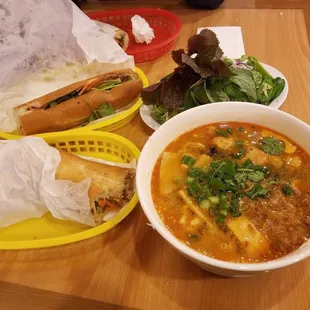 a bowl of soup and a sandwich