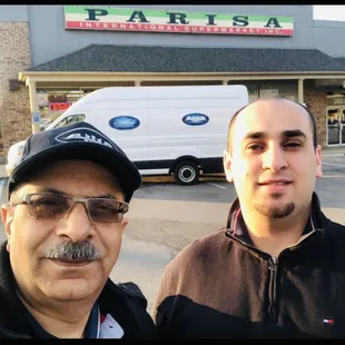 two men in front of the store