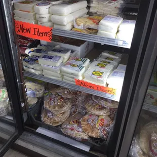 a display of cheeses and other foods