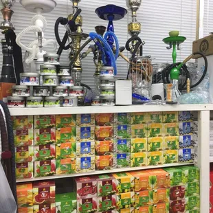 a man looking at a display of different types of tea