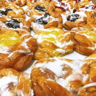 Freshly baked Danish filled with apple, lemon, blueberry and cherry!