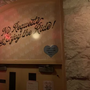 a sign on the wall of a restaurant