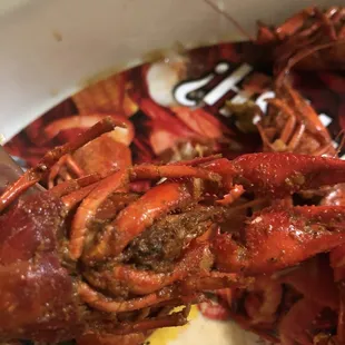 Look at that nasty  grittiness on outer shell of the so call spicy crawfish. The meat and claws were tasteless.