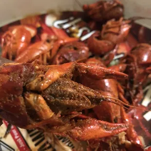 Parrish Seafood pour gritty bitter tasting spice on outer shell of their mild crawfish and call it spicy. What!!