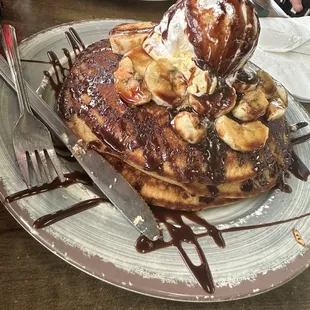 3 Pancakes with bananas, Nutella, and whipped cream.