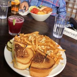 Garlic fries, grilled cheese, grilled salmon and salad, hibiscus margarita