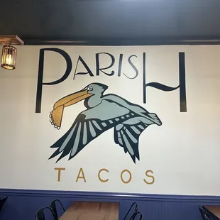 a large sign with a pelican on it