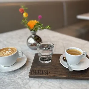 two cups of coffee on a table