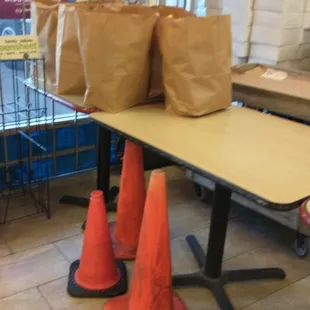 Cones with bags on the tables