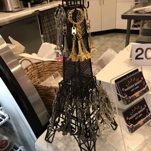 Key Chains of Eiffel Tower, Gift Cards by cash register.