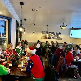 a large group of people sitting at a table