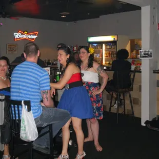 a group of people at a bar