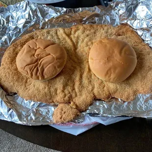 a fried chicken sandwich with a face on it