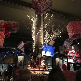 a christmas tree decorated with lights and presents