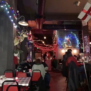 people sitting at tables in a restaurant