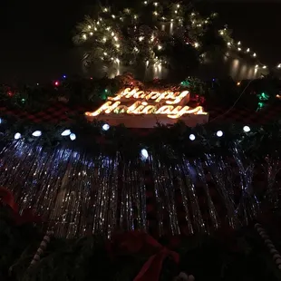 a christmas tree with lights in the background