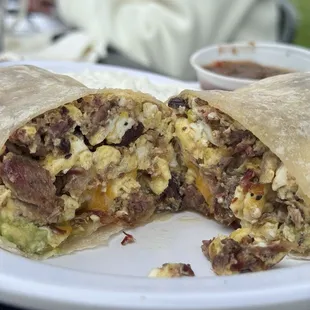 a breakfast burrito cut in half