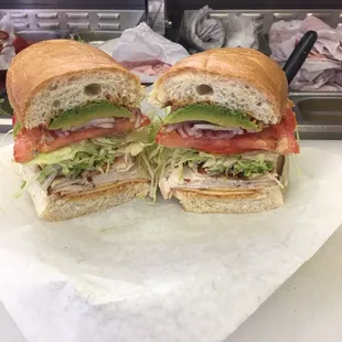 The JERK... Jamaican jerk chicken chipotle Gouda cheese your choice of honey mustard or cajon mayo lettuce tomatoes onions bacon and avocado